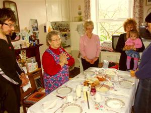 Ukrainian family standing around the table before dinner