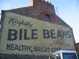 Sign on side of house advertising &#39;Bile Beans&#39;