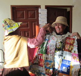 A local Bolivian woman wearing a crisp packet blanket. Hat and dress designed by Faye Waple