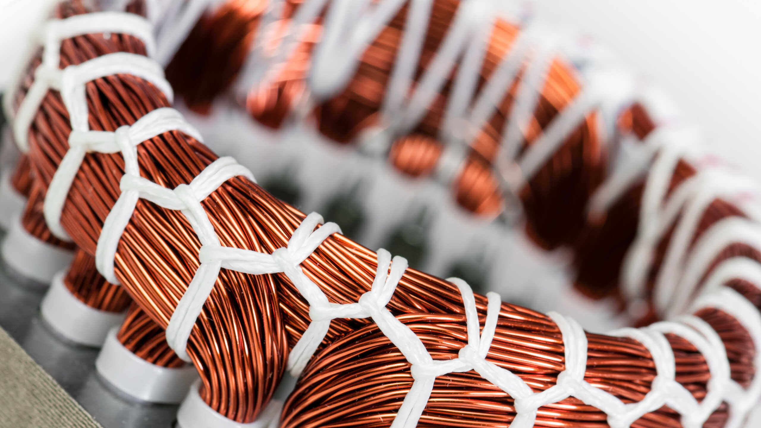 A close up of an electric motor stator and winding stack