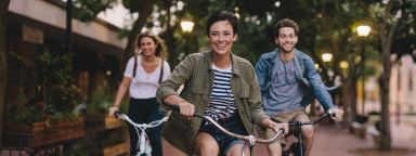 Students laughing on bikes