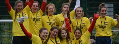Sport Sheffield women's team celebrating wearing trophies