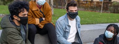 students wearing face coverings on the steps