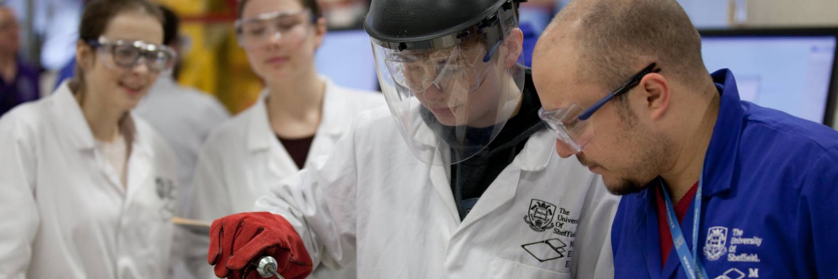 A student is working with a technical member of staff on a project - image