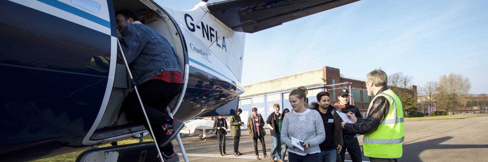 Students boarding a plane at Cranfield