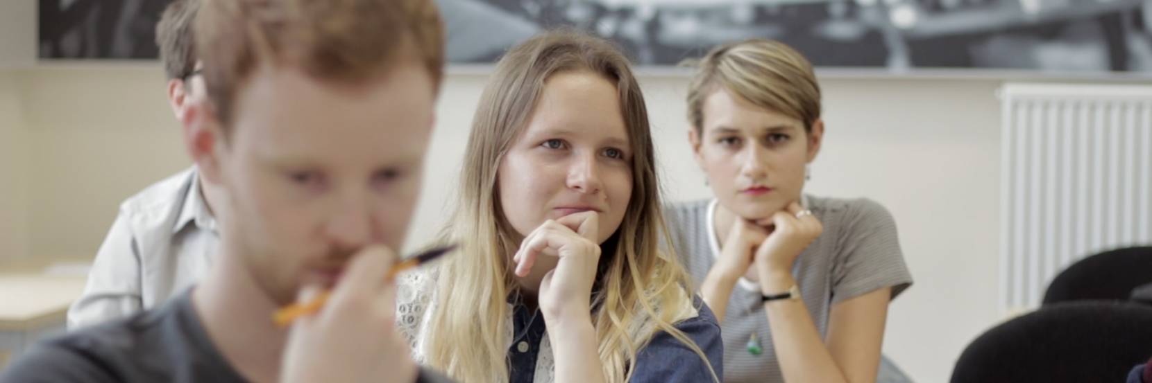 Three philosophy students in a seminar