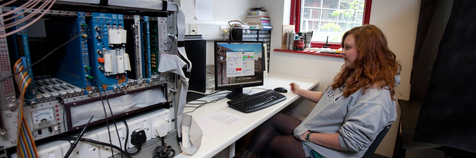 A student in a particle physics laboratory