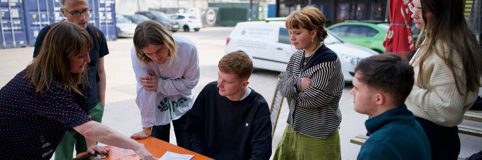 Amanda discusses field notebook with students