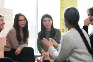 Image of discussion between postgraduate students in the department of languages and cultures