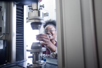 Image of postgraduate Materials Science and Engineering student with equipment