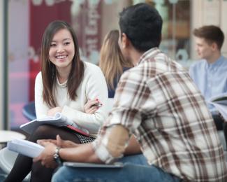 Image of two postgraduate students in the management school