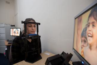 Postgraduate psychology student Kiera Solaiman using equipment