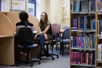 Image of Katharine Palmer, postgraduate School of Health and Related Research Student in the library