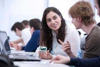 Two postgraduate ACSE students with equipment