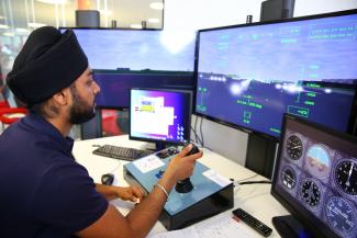 Aerospace student using high-tech equipment