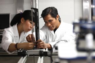 Civil Engineering postgraduate Wan Muhammad Djawad Wan in lab with colleague