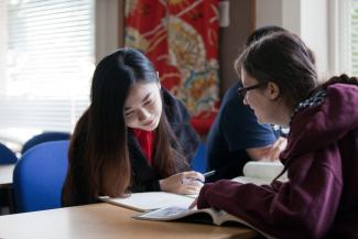 East Asian Studies postgraduate at desk