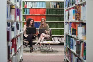Students in library with laptop