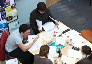 Postgraduate social research students at workshop