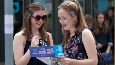 Two visitors on an open day looking at the self-guided city tour