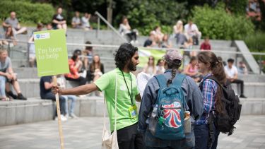 A current student talking to prospective students at an open day