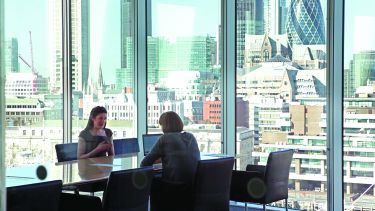 Alumna in a meeting in a London office