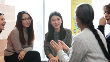 Image of discussion between postgraduate students in the department of languages and cultures