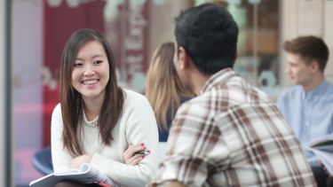 Image of two postgraduate students in the management school