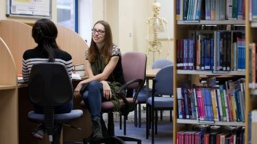 Image of Katharine Palmer, postgraduate School of Health and Related Research Student in the library