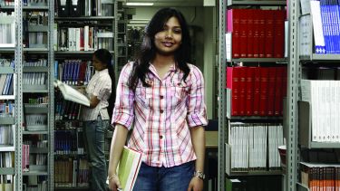 Postgraduate dentistry student in Library