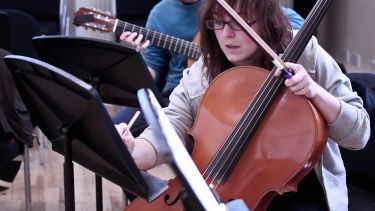 Postgraduate student performing and composing