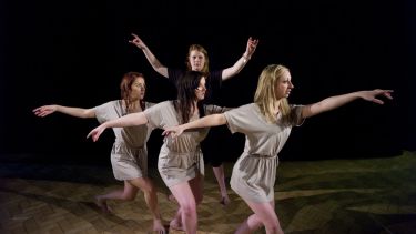 Female students performing a theatre production