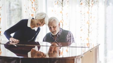 Couple playing the piano