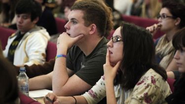 Students taking notes and watching lecturer in a lecture in Elmfield