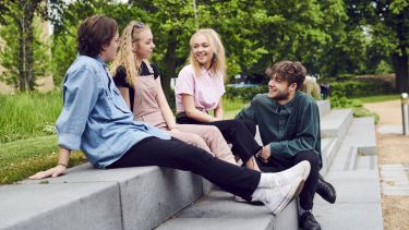 students sat on steps outside The Edge