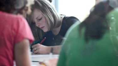 A student writes notes.