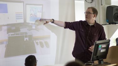A presentation takes place at Alumni Day 2016.