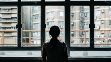 lonely person at window