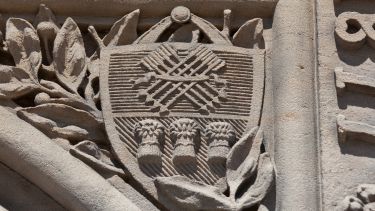 University logo in stone.