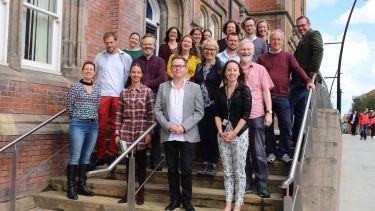 Group image. Music staff on Jessop building stairs