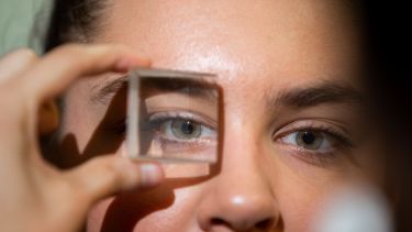 Orthoptics student looking through prism