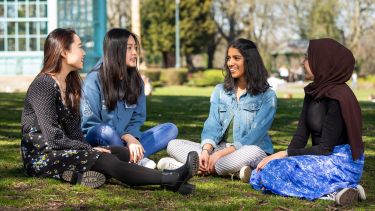A group of international students sat in Weston Park