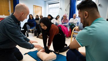 Students learning CPR