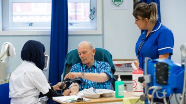 A patient as educator talking to a nursing student