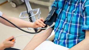 A patient having their blood pressure checked