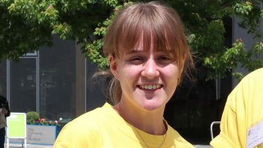 School of English student Leonie Howell smiling at camera outside Jessop West building