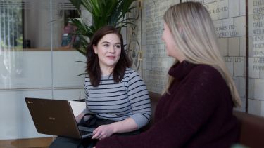 Student experience manager speaking with student
