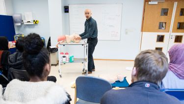 A lecturer leading a clinical skills session