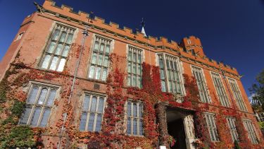 Firth Court with red vines growing up the walls - image
