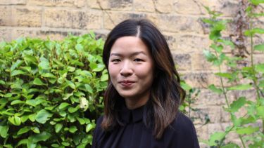 Nikki Soo Against Wall with Leaves